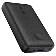 Black rectangular power bank lying flat with visible USB-A and USB-C ports on one end