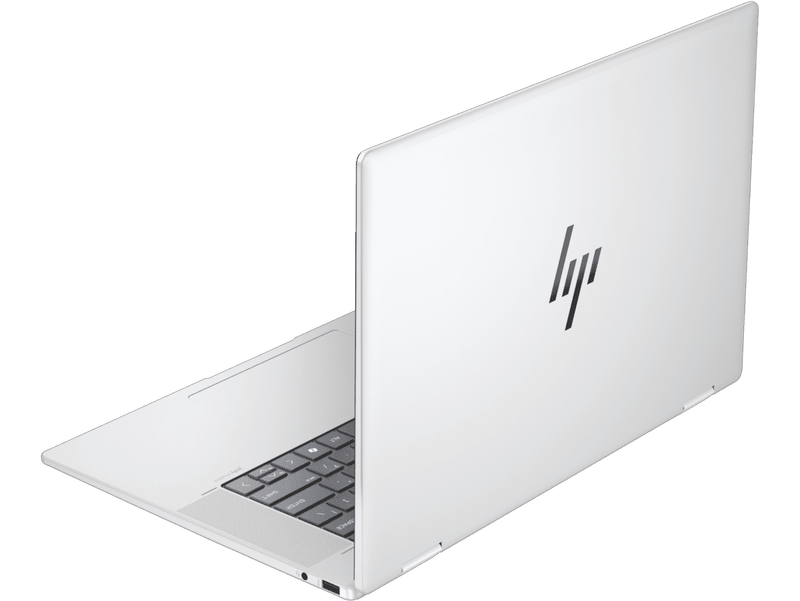White HP laptop on a green background